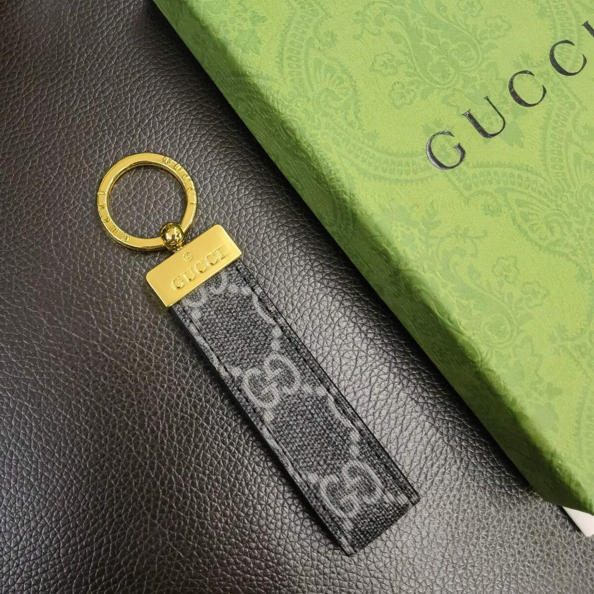 Luxury key chains by Gucci, featuring premium materials and iconic brand detailing.