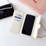 Chanel Phone Bag Case & Card Holder: Sleek design with the iconic Chanel logo.