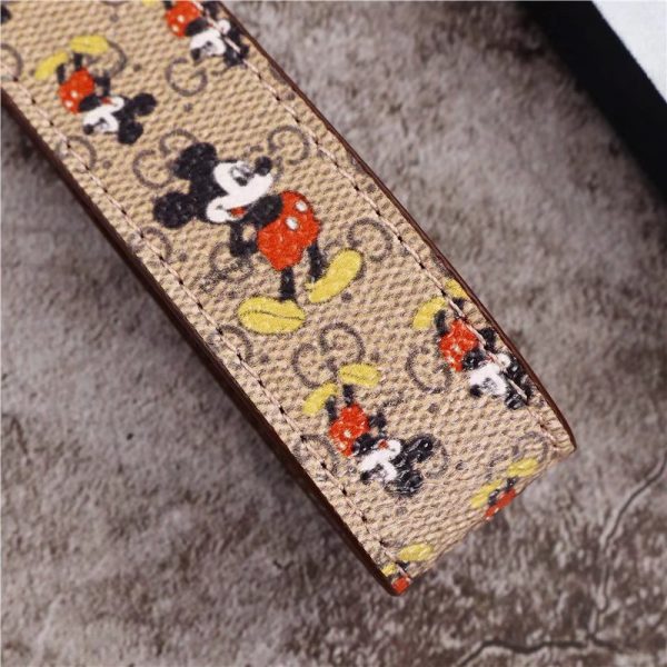 Stylish Mickey Mouse and Gucci keychains in sleek