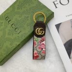 Gucci keychain with luxurious leather accents.