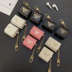 Signature Edition Prada AirPods Case attached to a designer bag