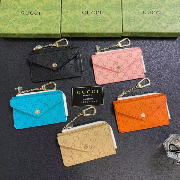Front view of the Gucci Signature Leather Wallet & Card Holder with GG monogram embossing