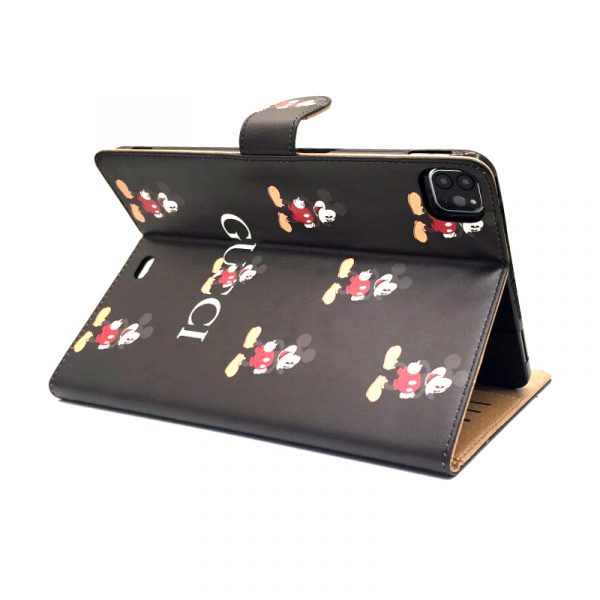 Luxurious Mickey Mouse and Gucci-themed iPad cases on display