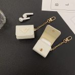 Prada Signature Edition AirPods Case on a marble surface