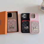 Black and pink Coach iPhone Cases with card holders for convenience